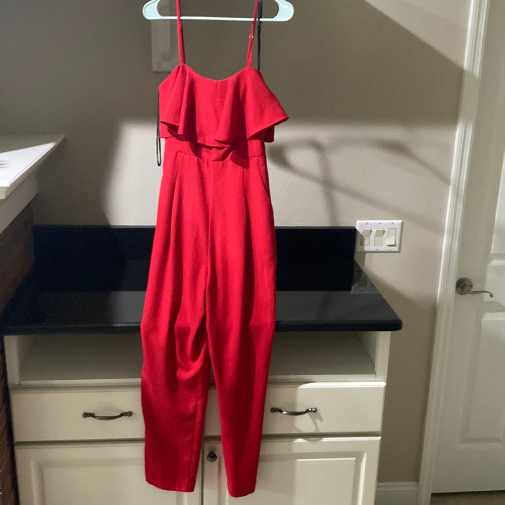 Red jumpsuit spaghetti straps , gently worn